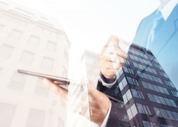 Double exposure of success businessman with abstract building